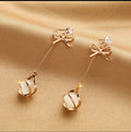 Gold bow tulip drop earrings - AR-141